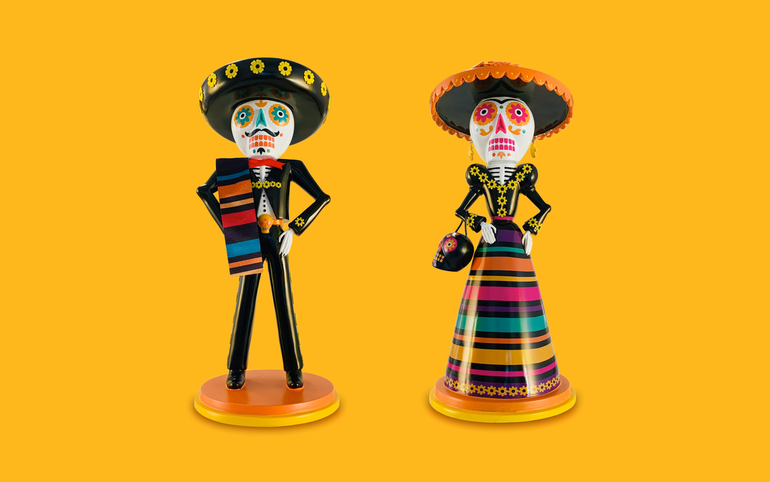 Day of the Dead couple figurines design by UNO Branding.