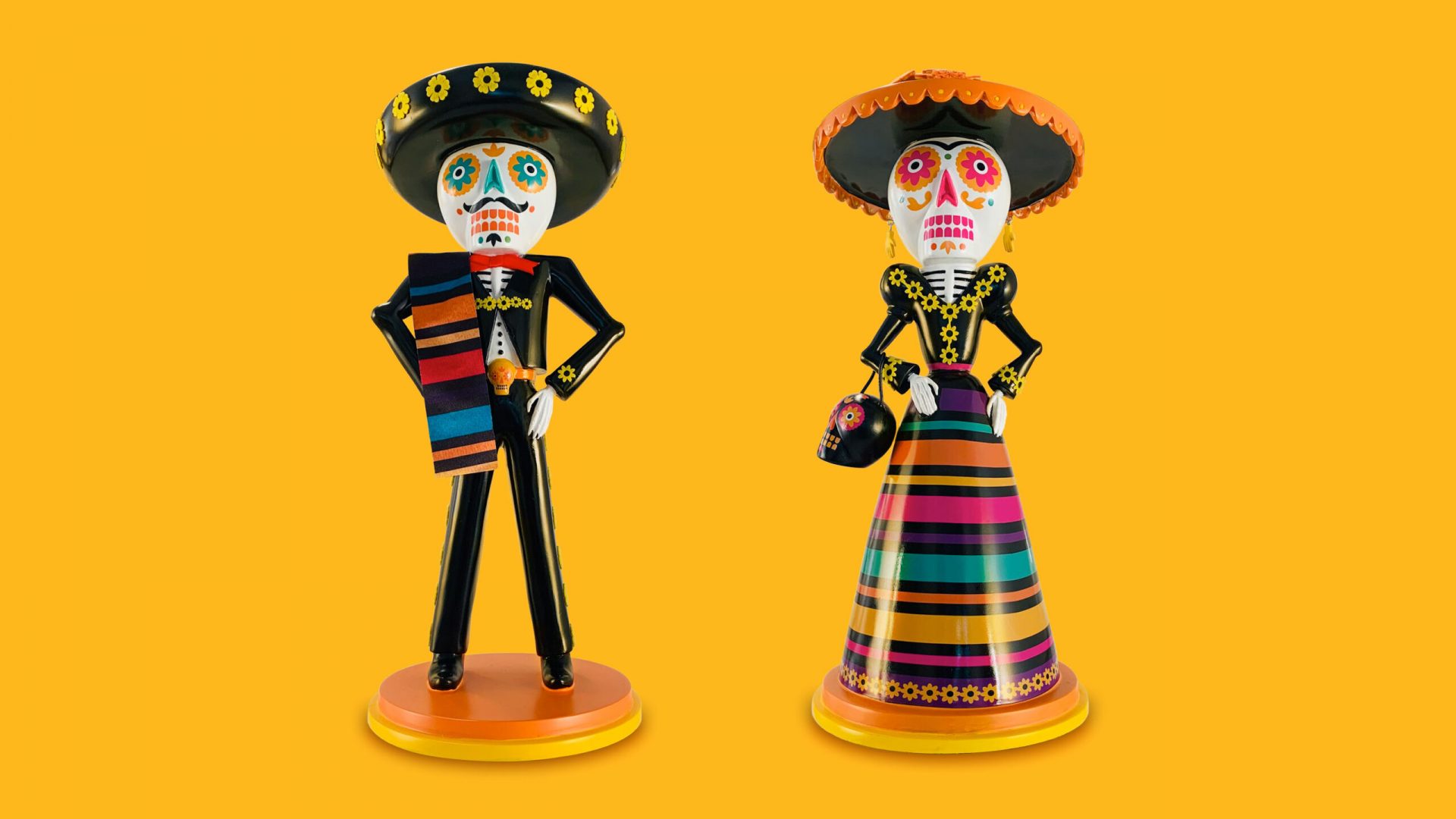 Day of the Dead couple figurines design by UNO Branding.
